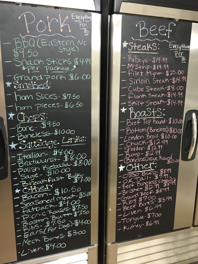 Chalkboards on freezers for pork and beef.