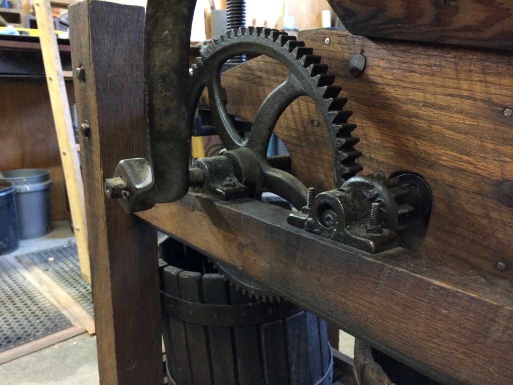 Antique apple press. Close up view of gears.