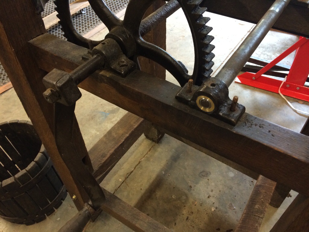 A fully repaired drive shaft and bearing for the apple press