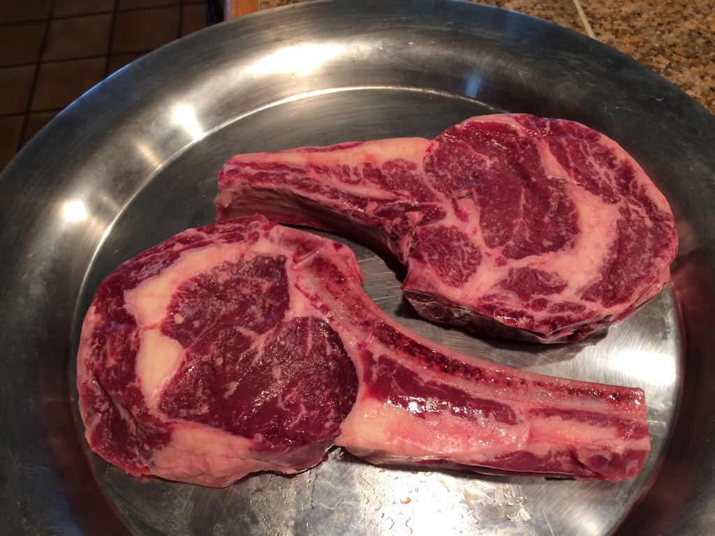 Ribeye steaks, ready to be cooked.