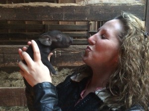 Lady with baby piglet