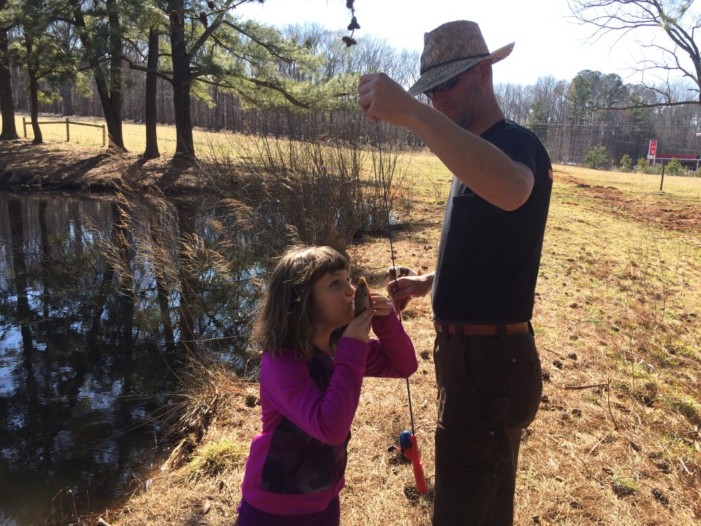 Kissing her first fish