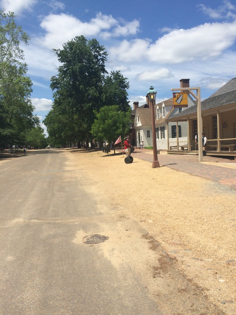 A gentleman from the 1700s, riding a Segway.