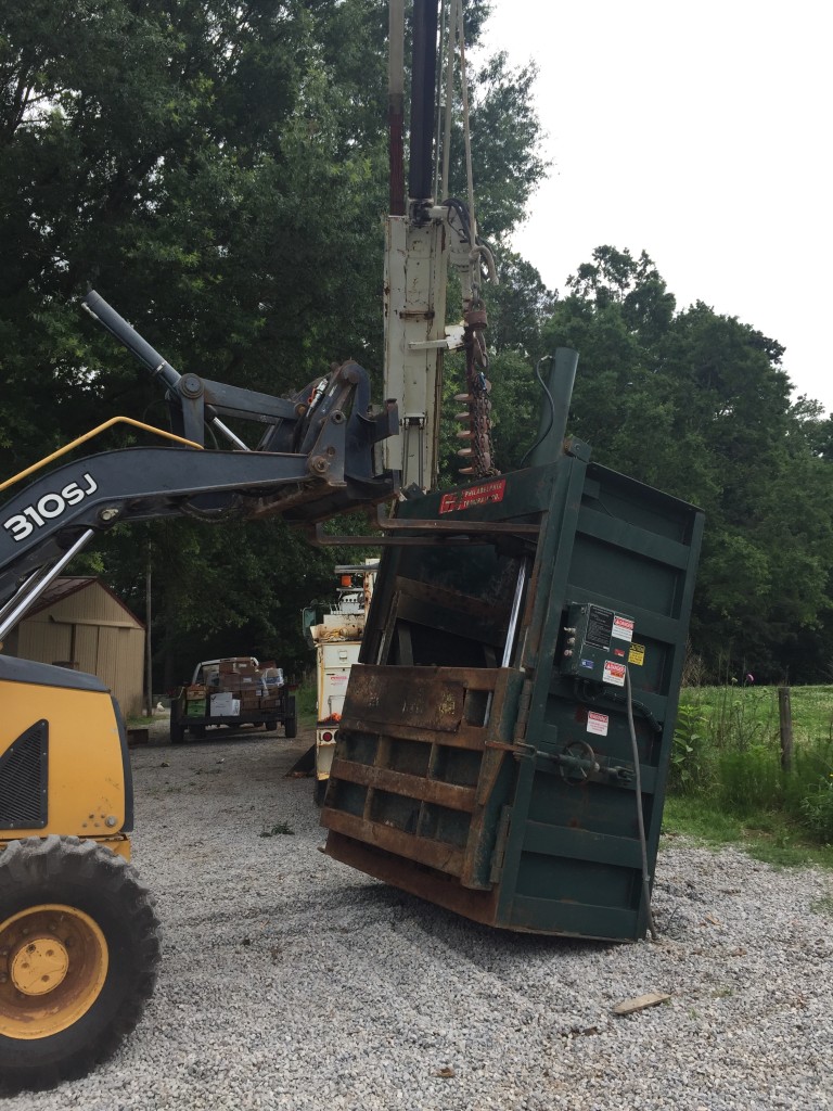 Giant cardboard baler. 