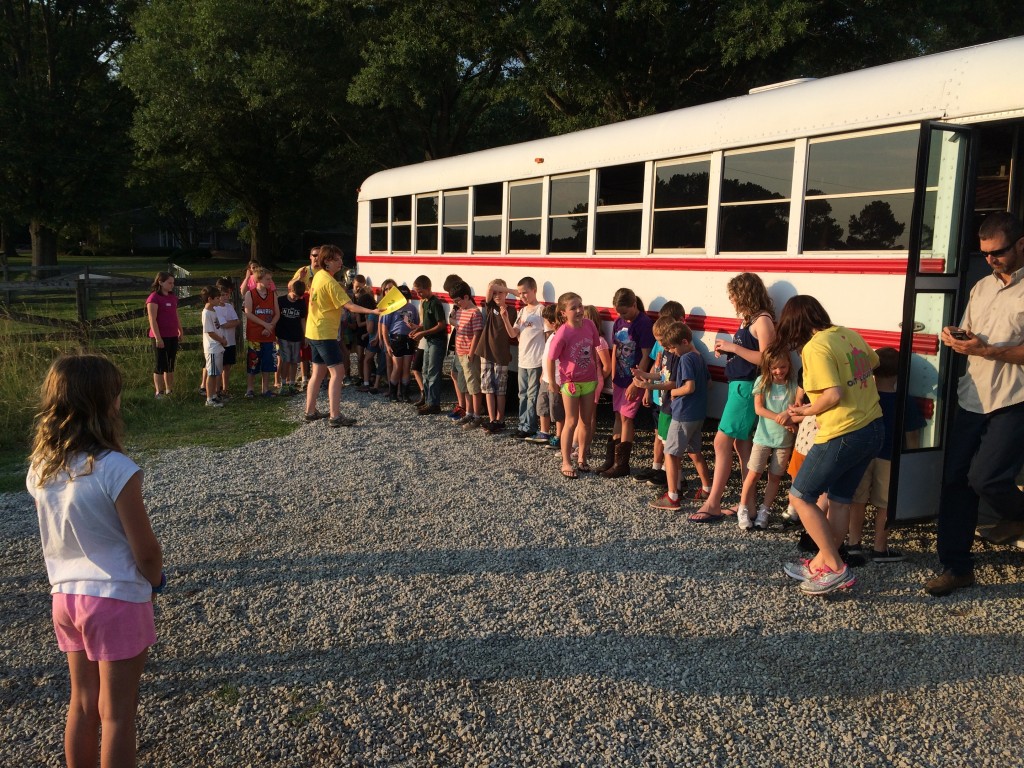 The kids arrive on their activity bus