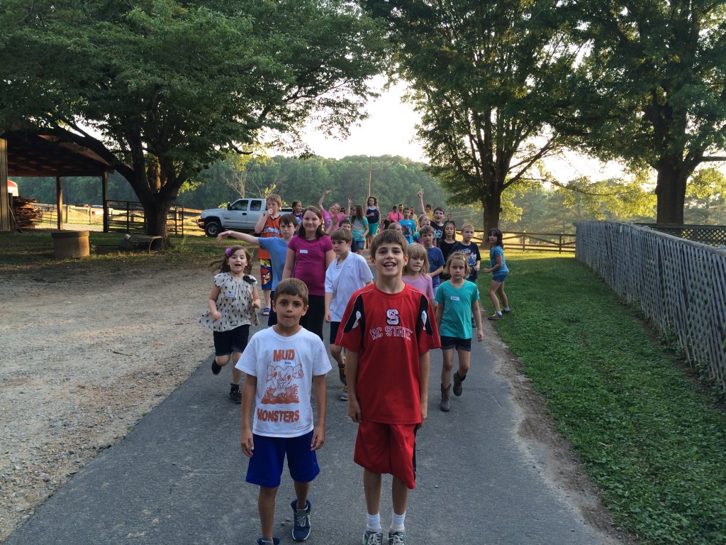 Kids walking on a farm road