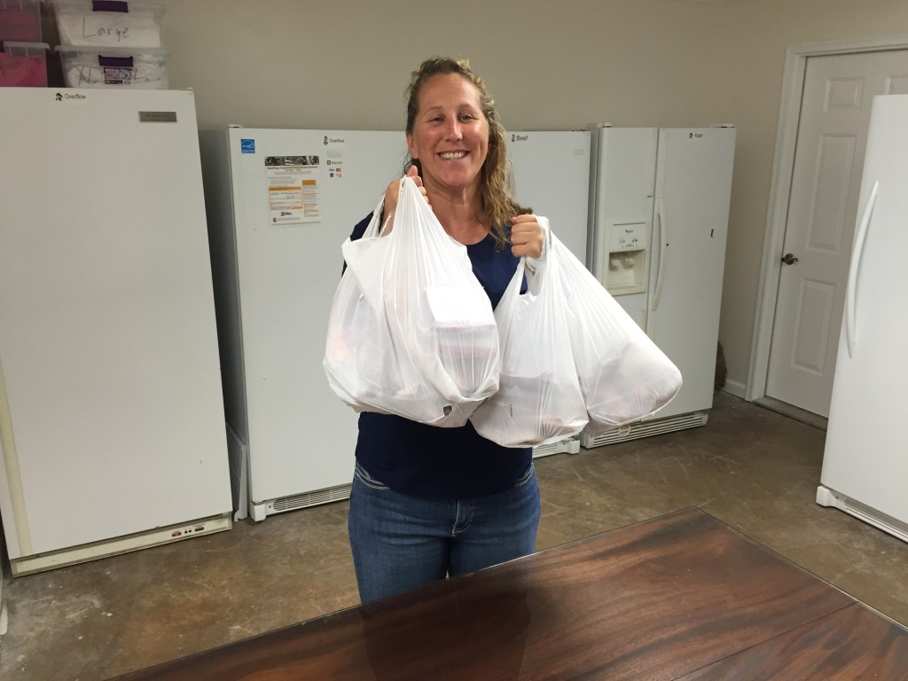 Happy customer buying meat at the farm