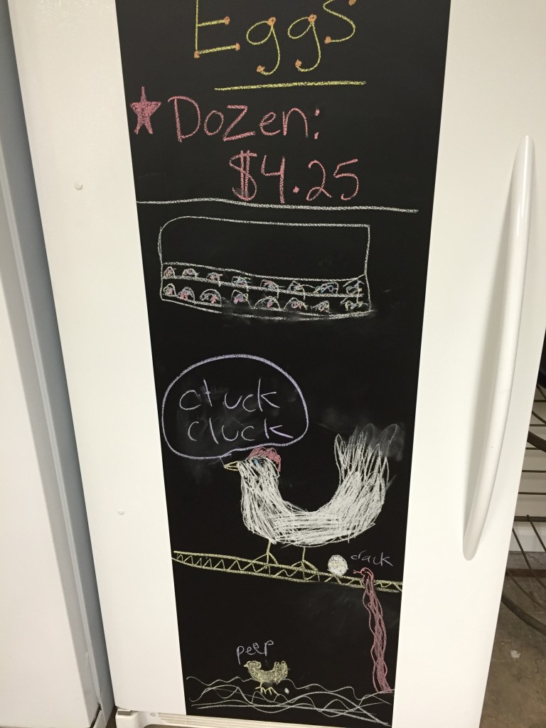 Kids drawing of a chicken on a chalkboard