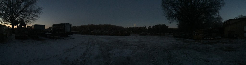 Full moon overlooking a frozen farm