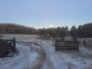 Full moon over a frozen farm