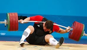 Weightlifter being crushed by weight