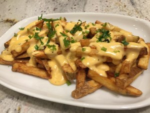 Ooey gooey hand pressed cheese fries