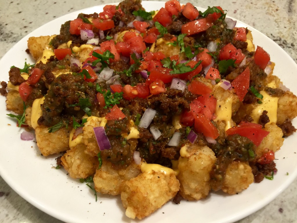 Loaded tater tot nachos with chorizo, pico and charred salsa verde