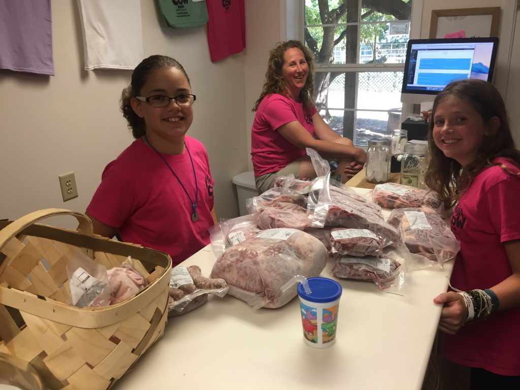 Wife and kids and a counter full of meat