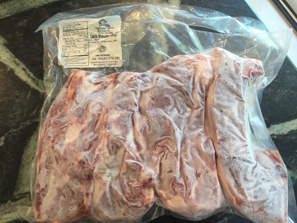 Frozen hunks of lamb shoulder