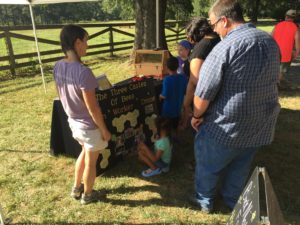 Jennifer from Buck Naked farm explaining about bees