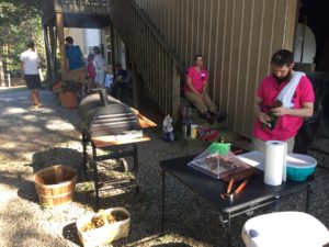 Abe working on his sausages, while Erin cools it in the shade for a few minutes