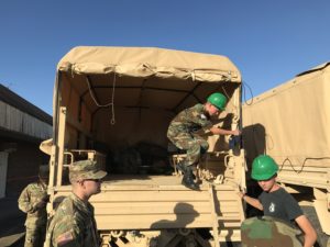 CAP cadet getting off of a military truck