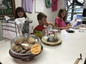 Kids at work in farm store