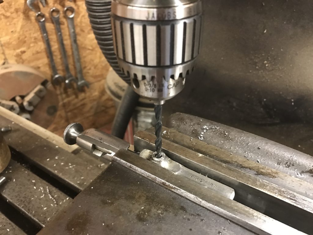 Drilling the hole for the new handle.