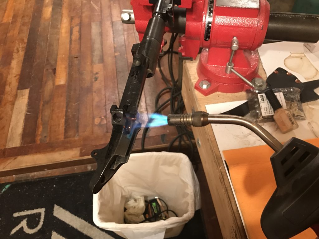 Heating the receiver to expand the metal