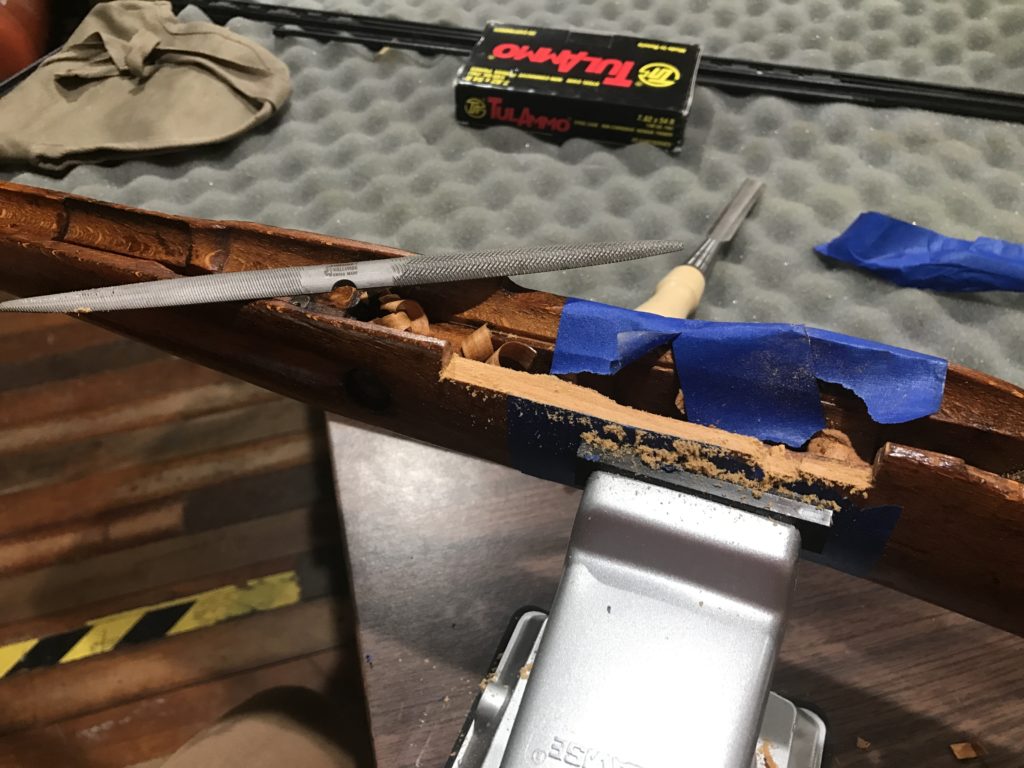 Filing out the wood on a stock