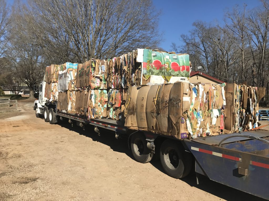 Tractor trailer loaded with cardboard bales