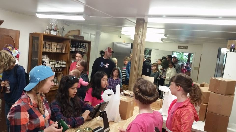 The girls, manning the store and handling the crowd.