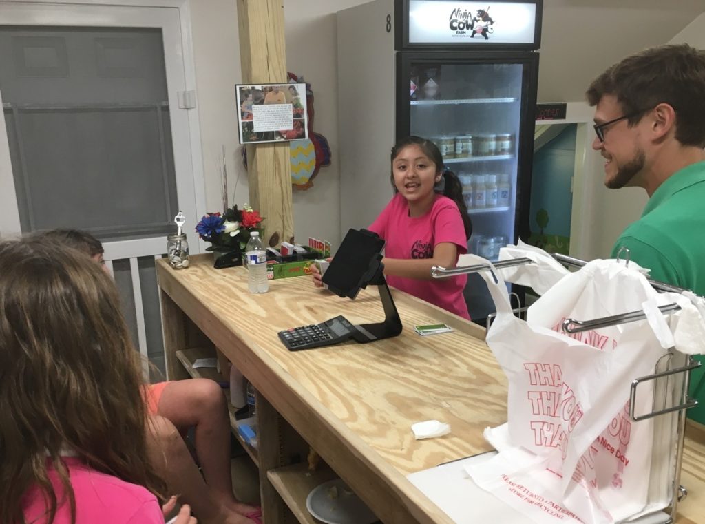 Girls playing apples to apples with Alarita