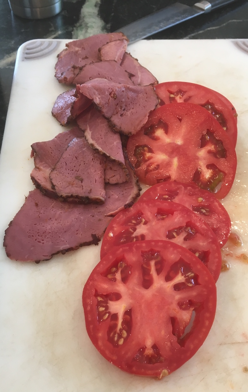 Pastrami and tomatoes cut up for lunch