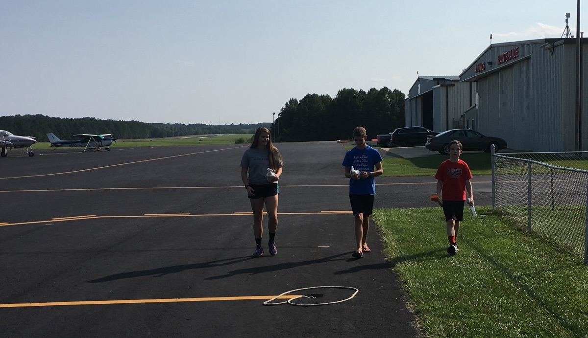 Spork and two other cadets at the airport on our work day