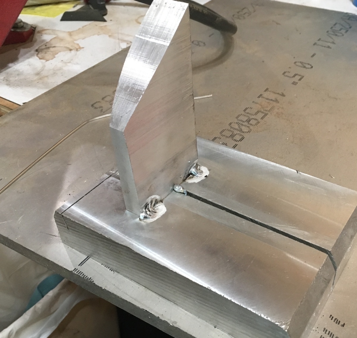 Welding up the legs onto the base plate