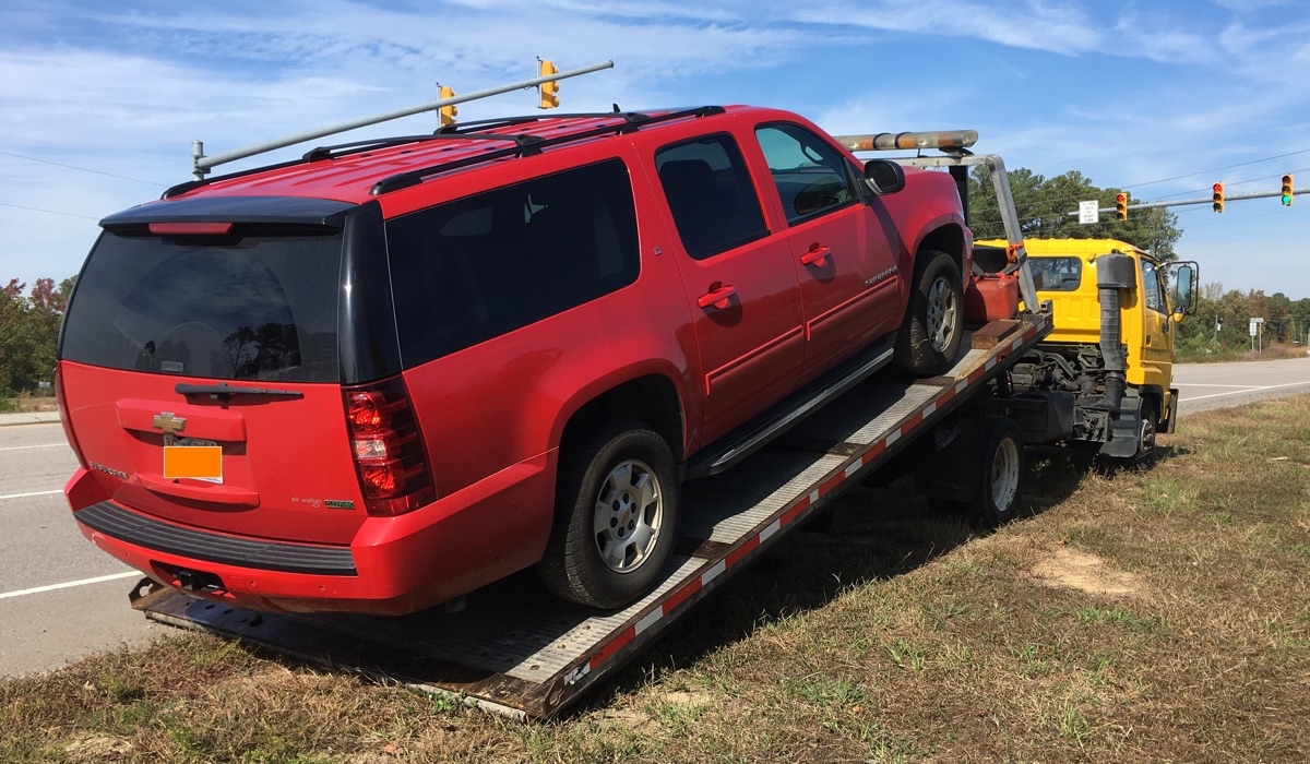 SWMBO's suburban on the rollback, being taken home