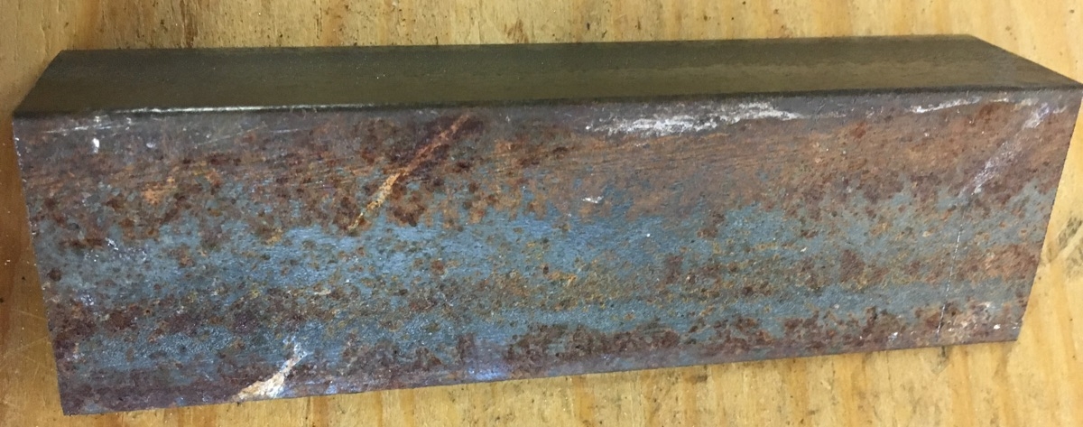 piece of metal with rust on it