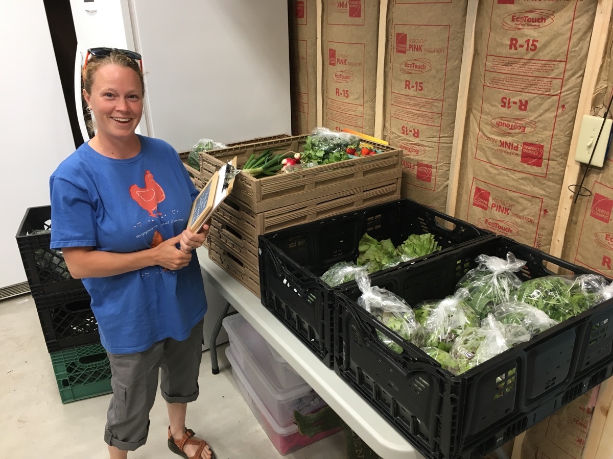 Jen delivering her first load of produce for our CSA program