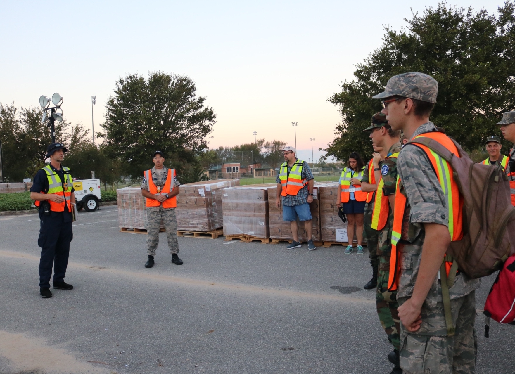 Briefing cadets, county workers, and military for the days operations