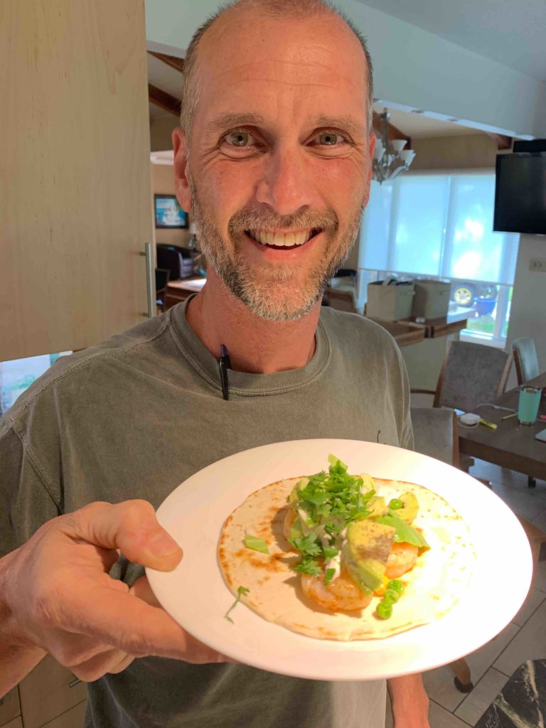 Farmer Dan with a shrimp taco