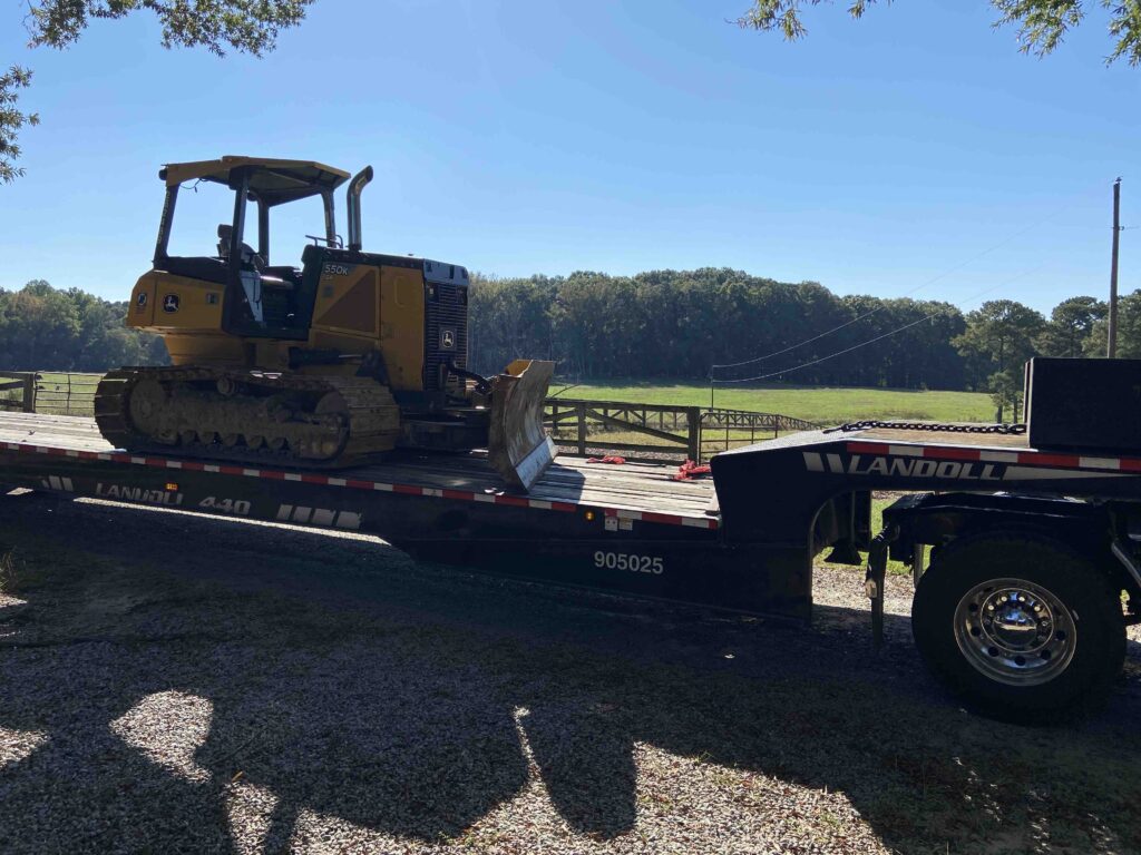 John Deere 550k dozer on truck