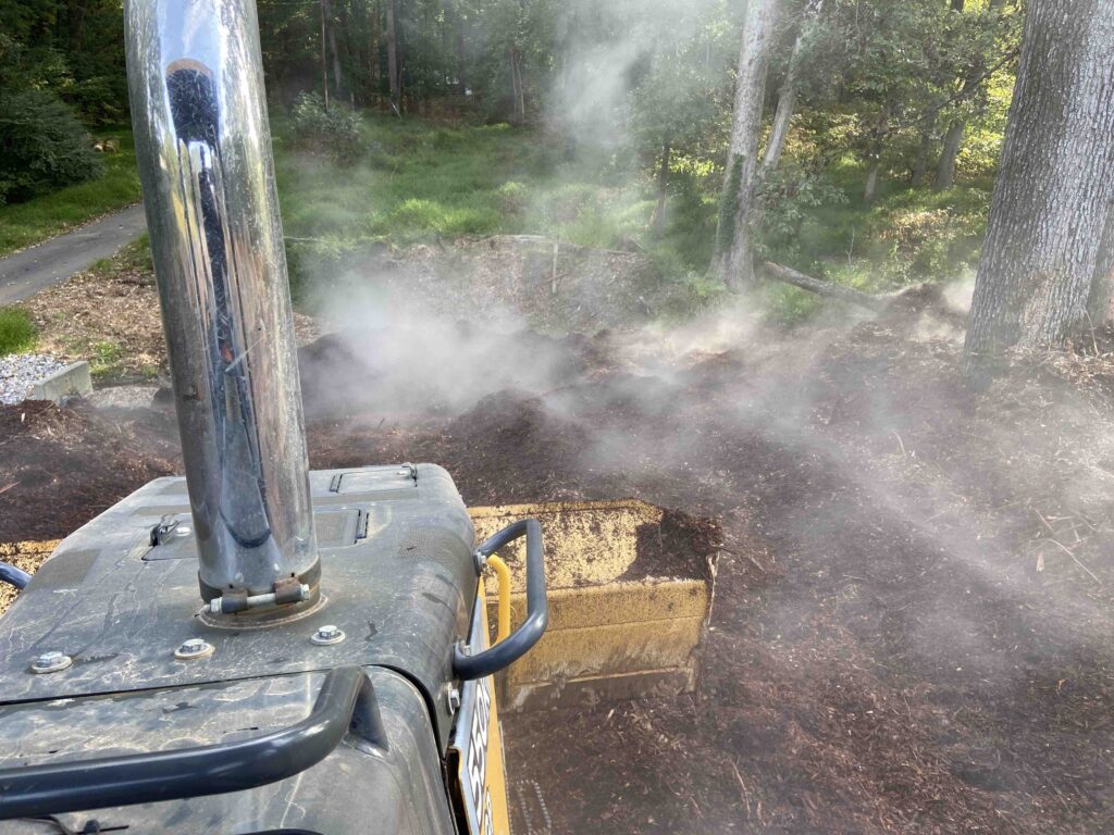 Pushing steaming chips with a bulldozer