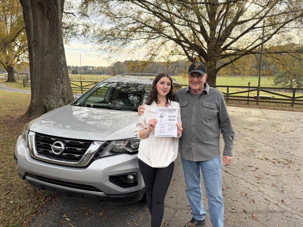 Myla and Grandpa with Myla's new drivers license